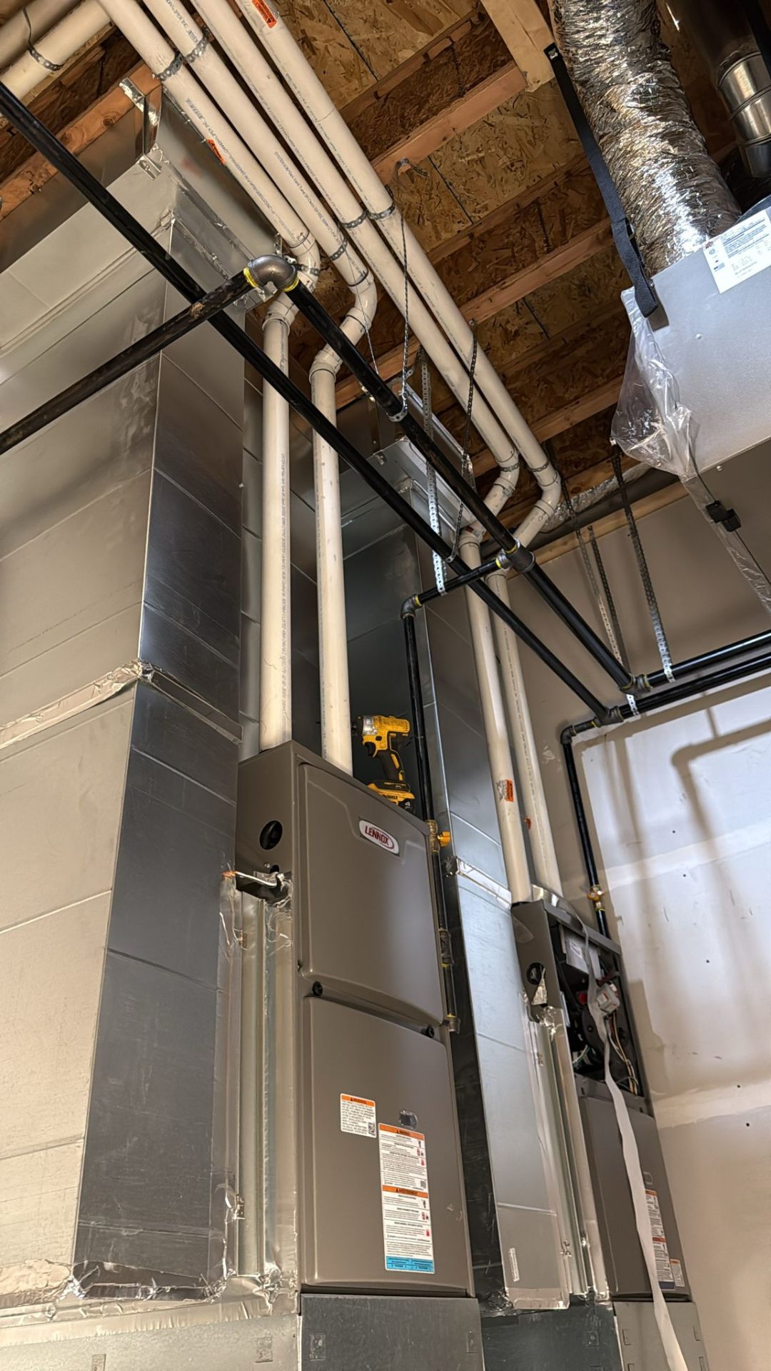 Fourplex HVAC rough-in, Edmonton — Glenora four-unit infill with separate Lennox furnace and HRV per unit.