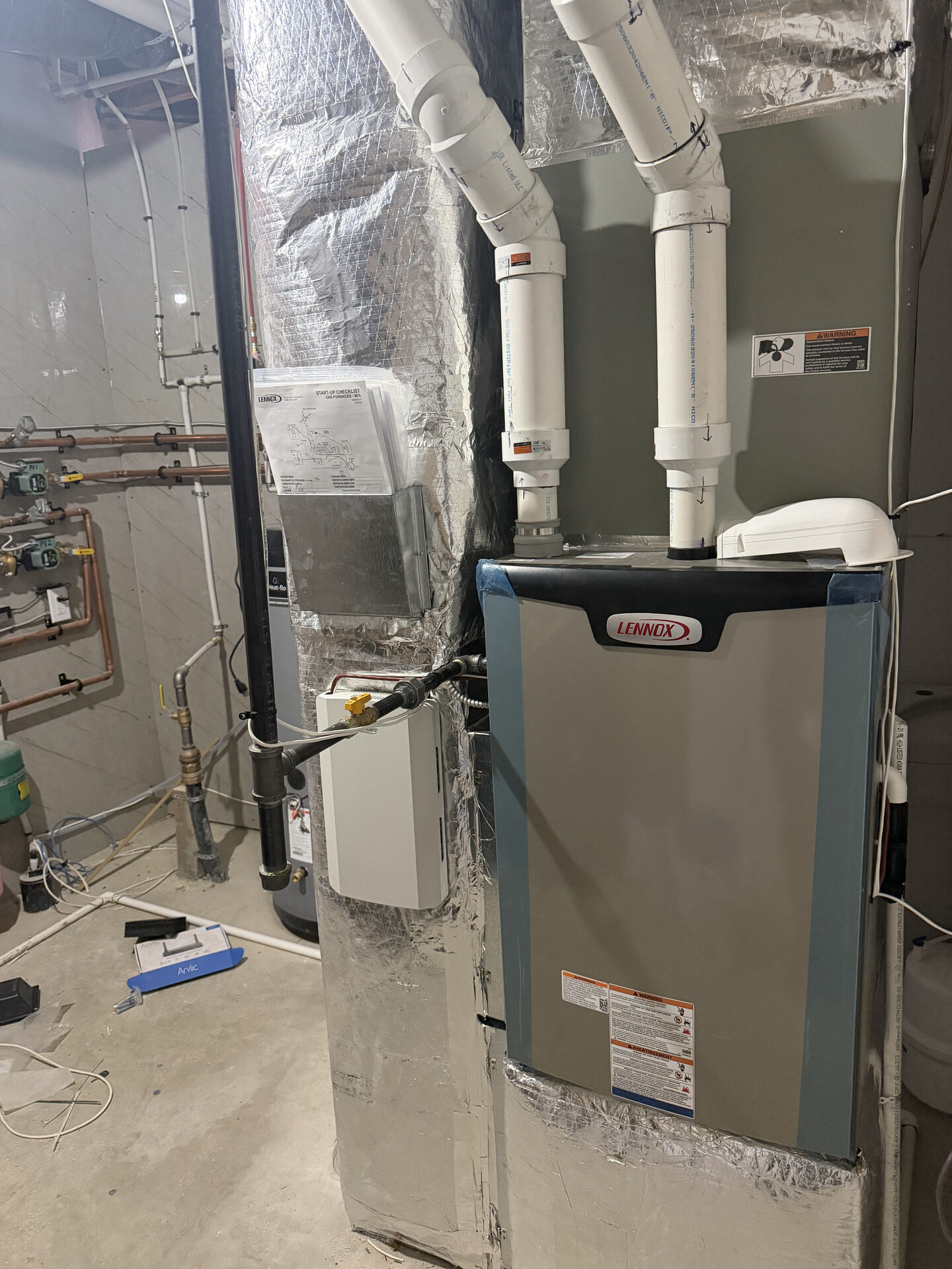 Lennox SLP 99 modulating furnace and Trane 3 side-discharge A/C installed in Alces custom spec home, Edmonton, by City Mechanical.