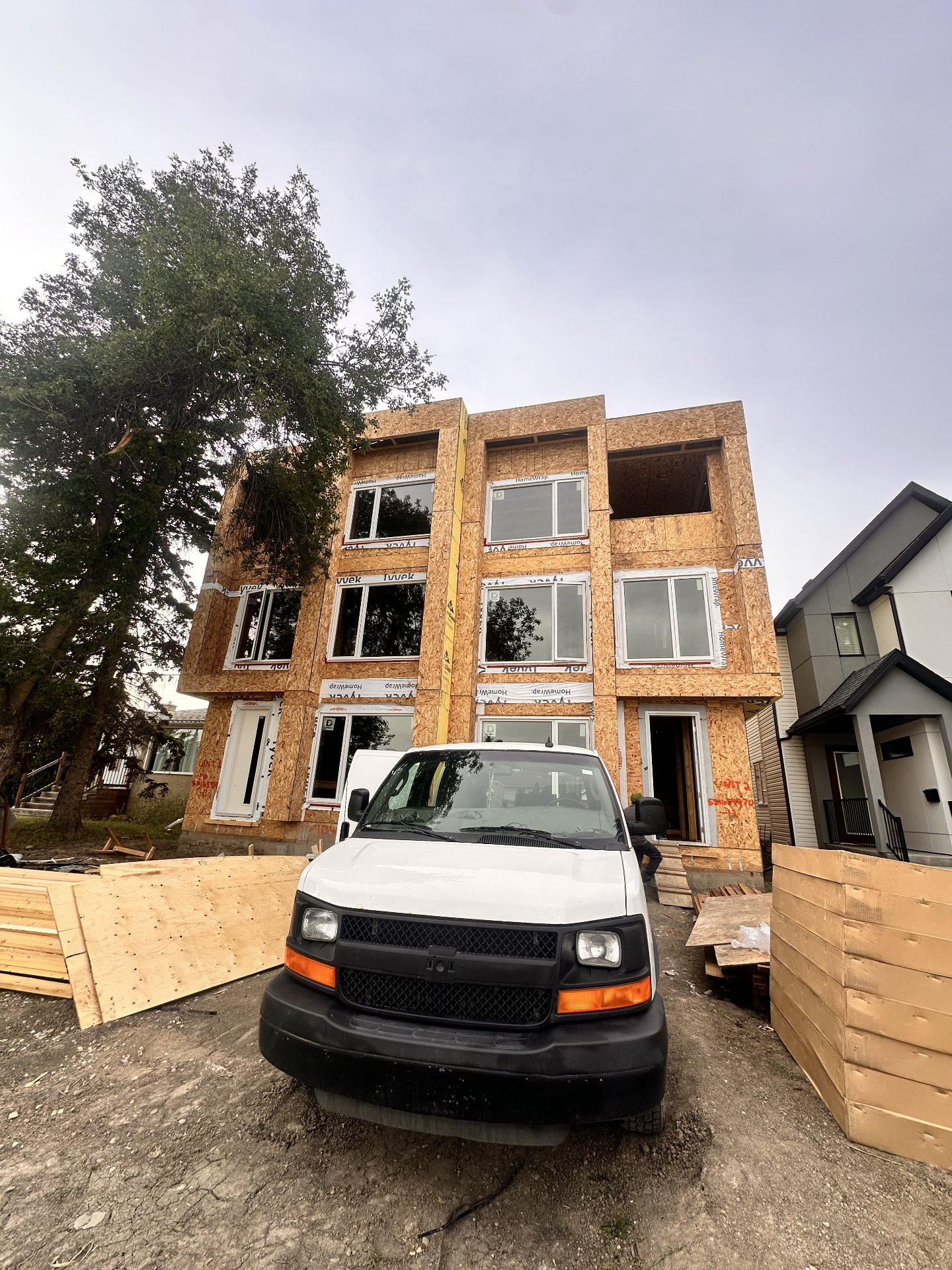 Fourplex new construction HVAC rough-in by City Mechanical in Glenora, Edmonton — four-unit infill build with separate furnace and HRV per unit.